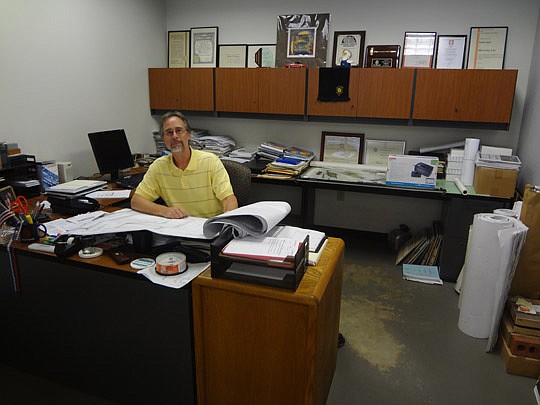Photo by David Chapman - City Council President Bill Bishop is a founding partner of the Akel, Logan &amp; Shafer architecture firm and has been a practicing architect since 1983. It's a career he has wanted since drawing in middle school and he likes...