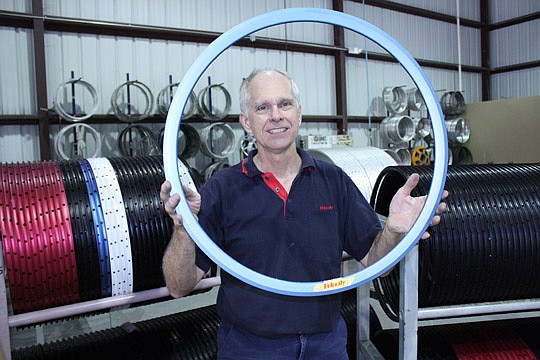 Photo by Joe Wilhelm Jr. - Tom Black, founder of Velocity, holds what he claims is one of the only American-made rims in the country. Velocity's factory was relocated from Brisbane, Australia, in January to the Riverside area of Jacksonville. The fact...