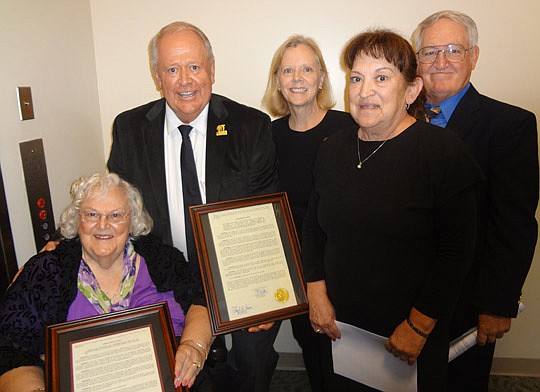 Photo by David Chapman - Family of the late Peter Bragan Sr. received a framed Council resolution honoring and commemorating the life and accomplishments of the longtime Jacksonville Suns owner. His son and current owner, Peter Bragan Jr. (second from...