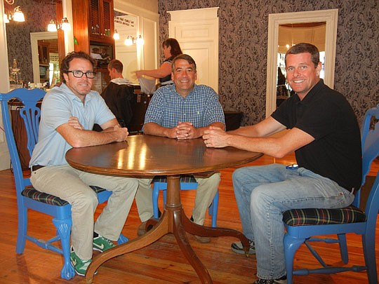 Photo by Karen Brune Mathis - High-school friends Ty Petway, Phillip Hewett and Michael McAfee in the Old School Barber Shop in Avondale. They will open their third shop Saturday in the Julington Creek area.