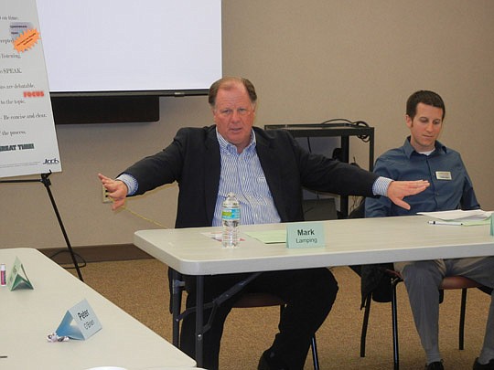 Photo by Karen Brune Mathis - Jacksonville Jaguars President Mark Lamping (left) talked about leadership Wednesday evening with the Jacksonville Community Council Inc. Forward young professionals. He is seated next to forum co-chair Jonathan Hanson.