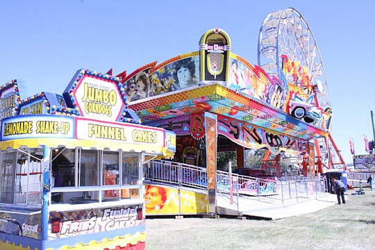 Photos by Joe Wilhelm Jr. - Rides, food vendors and amusements are located near the Baseball Grounds of Jacksonville and the parking lot between it and EverBank Field. The fair will be at the Expo Center at the Fairgrounds until Nov. 11.