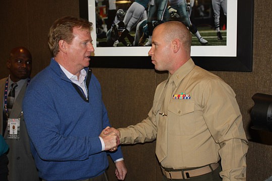 Photo by Max Marbut - NFL Commissioner Roger Goodell (left) shakes hands with Lt. Alex Sell of the U.S. Marine Corps after the commissioner's meeting Thursday at EverBank Field with 100 Jacksonville Jaguars season ticket holders. Goodell and Sell were...