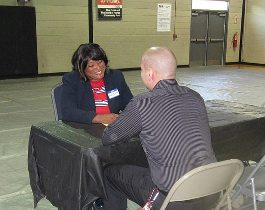 Pro bono attorney Melina Buncome provides guidance at the Ask-A-Lawyer event at the Johnson YMCA.
