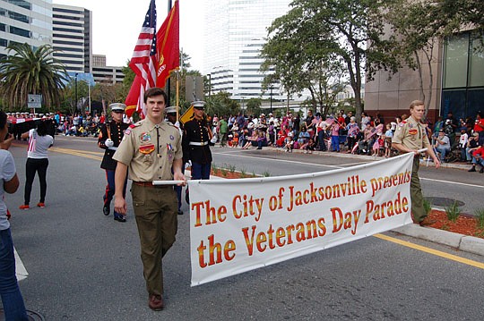Photos by Max Marbut - Members of the Army, Navy, Air Force, Marines, Coast Guard and Boy Scouts of America on Monday march in the City's annual Veterans Day Parade.