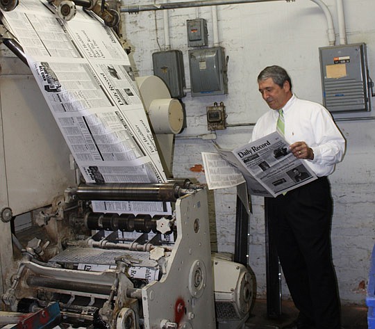 Photo by Joe Wilhelm Jr. - The Financial News &amp; Daily Record has been printed for more than 26,000 weekdays without interruption, and for the past 38 years James F. Bailey Jr. has been publisher. Bailey is the third-generation owner of the paper, ...