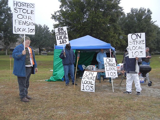 Photo by Karen Brune Mathis - Members of the Bakery, Confectionary, Tobacco Workers and Grain Millers International Union Local 103 continued picketing at the North Jacksonville Hostess bakery early today after learning the company plans to liquidate ...
