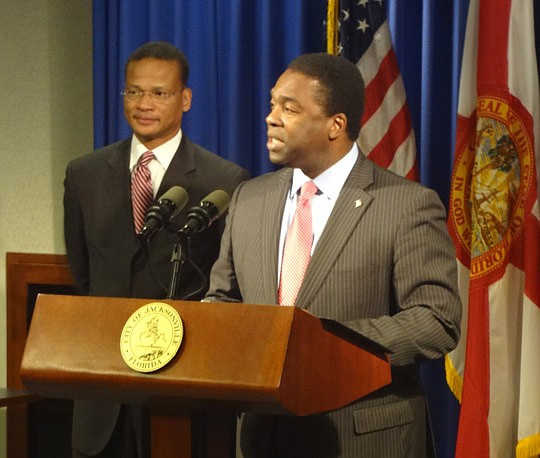 Photo by David Chapman - Mayor Alvin Brown speaks of Ted Carter (left) and his credentials Friday during an introductory news conference announcing the appointment.