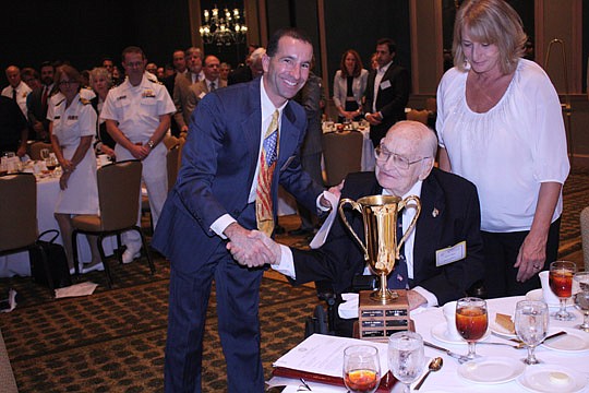 Photos by Joe Wilhelm Jr. - Blane McCarthy (left) chair of The Jacksonville Bar Association Raymond Ehrlich Trial Advocacy Seminar, presents former Judge Tyrie A. Boyer with The JBA Raymond Ehrlich Trial Advocacy Award at the Nov. 12 The JBA Veterans ...