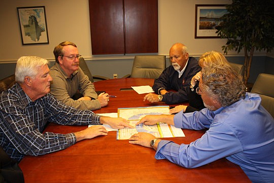 Photo by Joe Wilhelm Jr. - From left, Rich Redick, St. Johns River Ferry Commission member; Tom Goldsbury, City Public Works Department engineer manager; Jim Suber, City dockmaster; Victoria Robas, Jacksonville Port Authority Terminal Blount Island, D...