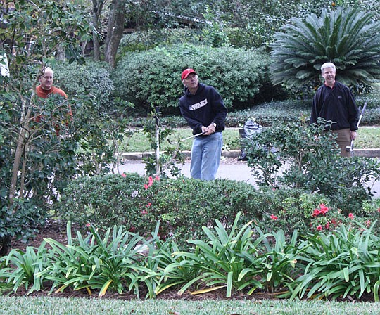 Photos by Joe Wilhelm Jr. - Attorney Warren Anderson tees off at the second hole of the Pajcic &amp; Pajcic 2012 Backyard Golf Tournament on Nov. 15 in Riverside to benefit Jacksonville Area Legal Aid.