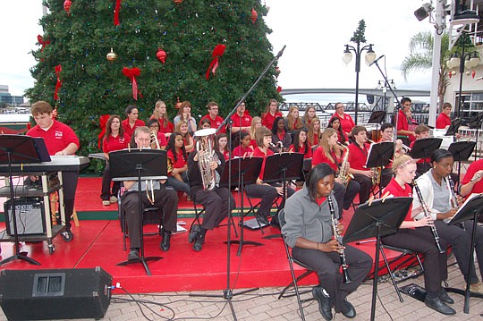 Photo by Max Marbut - The Bishop Kenny High School Symphonic Band and Concert Chorale performed Thursday at the Landing, part of the annual "Holiday on the River" dance and concert series. For the past 26 years, the Landing has presented holiday musi...