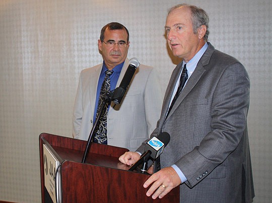 Photos by Joe Wilhelm Jr. - Jacksonville Aviation Authority CEO and Executive Director Steve Grossman announces plans to expand the Flightstar Aircraft Services facility at Cecil Airport as Flightstar President and CEO Jerry Hernandez looks on.