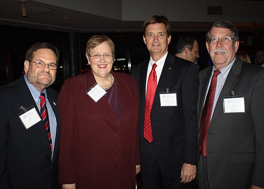 Photos by Joe Wilhelm Jr. - From left, E. Robert Williams American Inn of Court President Alan Gordon, The Florida Bar President Gwynne Young and past Inn Presidents Ben Samuels and Jake Schickel at the Inn's annual holiday social.