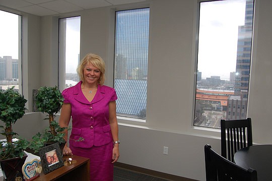 Photos by Max Marbut - Health Planning Council of Northeast Florida President and CEO Dawn Emerick in her office on the eighth floor of the Jacksonville Bank Building.