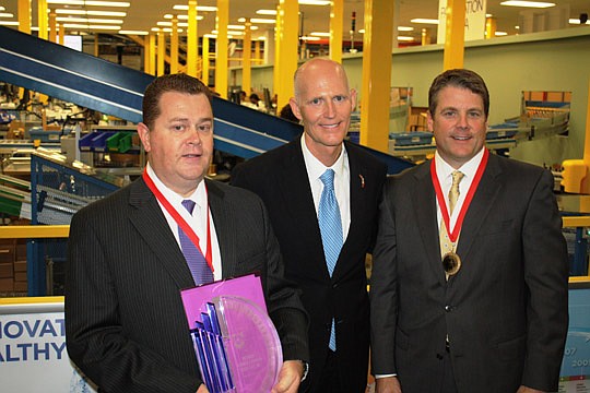 Photo by Joe Wilhelm Jr. - Gov. Rick Scott announced his plans Wednesday to boost manufacturing in Florida during a visit to Jacksonville-based Vistakon. Vistakon has been recognized as a Manufacturers Association of Florida's "2012 Manufacturer of th...
