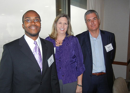 Photo by Karen Brune Mathis - From left, Ennis Davis of Metro Jacksonville Inc., Erika Alba of the Foley &amp; Lardner law firm and Michael Drexler of Deutsche Bank shared industry trends and predictions with the Association for Corporate Growth North...