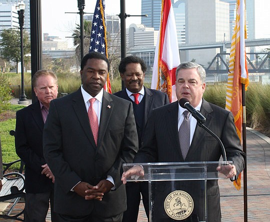 Photo by Joe Wilhelm Jr. - Steve Halverson, (at the podium) chair of the Jacksonville Civic Council, applauded a proposal by Mayor Alvin Brown to designate $11 million for economic development. He was joined (from left) by City Council member Don Redm...