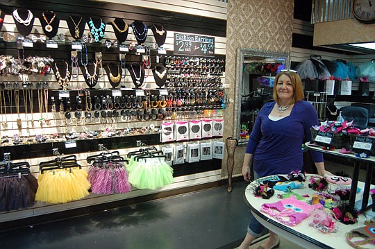 Photo by Max Marbut - Carolyn Price, manager of the new Frugal Diva store at the Landing.