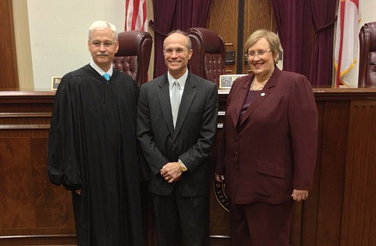 Florida Supreme Court Chief Justice Ricky Polston, The Florida Bar President's Pro Bono Service Award recipient Emerson Lotzia and Bar President Gwynne Young.