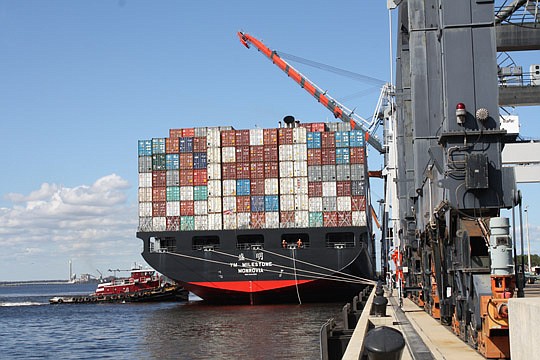 Photo by Joe Wilhelm Jr. - The Yang Ming Milestone arrived Jan. 31 at the Jacksonville Port Authority's TraPac container terminal as the largest vessel to ever call on Jacksonville's seaport. The ship can transport up to 6,600 TEU container units. The...