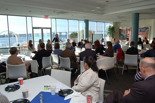 Photo by Max Marbut - With the St. Johns River as the backdrop, about 100 people gathered Friday at the Haskell Building to see an idea for a new way to promote the Downtown riverfront.