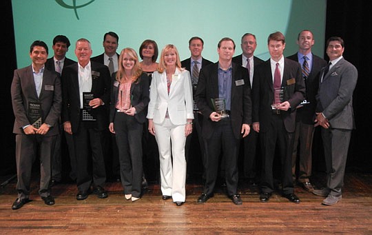 Photos by Karen Brune Mathis - Winners of the annual NAIOP awards for commercial real estate excellence include (from left) David Ergisi, Victor Hughes, Hobart Joost, Joe Newell, Julie Bohn, Terry Lorince, joined by NAIOP President Traci Jenks, Dan Sa...