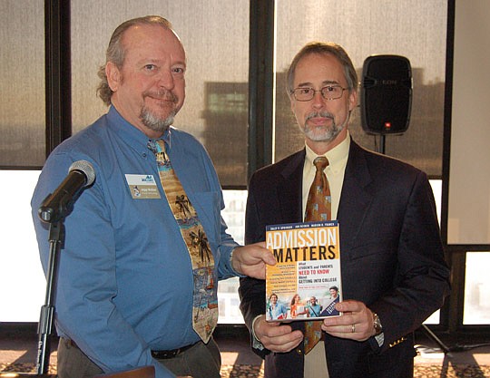 Photo by Max Marbut - Jepp Walter, JAX Chamber Downtown Council past president, and City Council President Bill Bishop. Bishop was the council's guest speaker Friday and signed a copy of "Admission Matters." The book will be donated to the library at ...