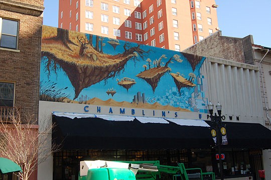 Photo by Max Marbut - Chamblin's Uptown bookstore and cafÃ© along Laura Street is the site of Downtown's latest public art project, a fantasy-scene mural by artist Shaun Thurston. The cafÃ© is the gathering place for "Jax Pack Downtown Merchants," a g...
