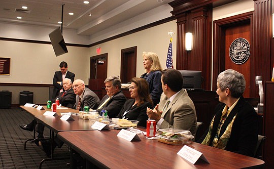 Photos by Joe Wilhelm Jr. - Circuit Court Judge Mallory Cooper introduces the panel of judges Wednesday at The Jacksonville Bar Association Sidebar Lunch at the Duval County Courthouse. From left, Gene Nichols, moderator of the panel discussion; Senio...