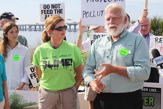 Photos by Joe Wilhelm Jr. - St. Johns Riverkeeper Lisa Rinaman looks on as Kayak Amelia owner Ray Hetchka talks about the economic impact algae blooms have on his and other businesses in an effort to urge legislators to oppose House Bill 7115 and Sena...