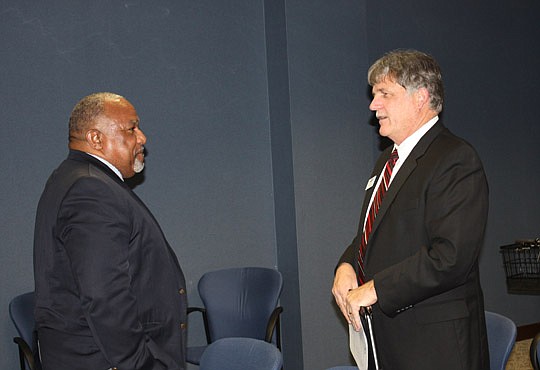 JEA board of directors mayoral appointee Wyman Winbush (left) and Mike Brost, JEA vice president and general manager of electric systems, attended Tuesday's board meeting. City Council is scheduled to vote Tuesday on Winbush's appointment.