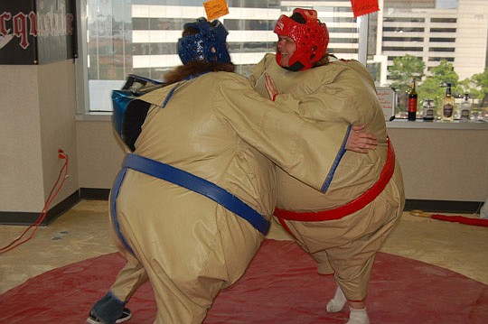 The creators of Bucquistador.com, a social networking site based on "bucket lists," didn't invent sumo wrestling suits, but they are using them at One Spark to draw attention to their product.