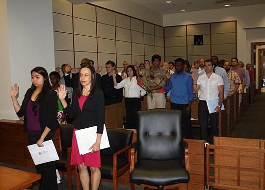 About 50 people were sworn in as U.S. citizens Thursday at the Bryan Simpson U.S. Courthouse as part of The Jacksonville Bar Association's Law Day celebration.
