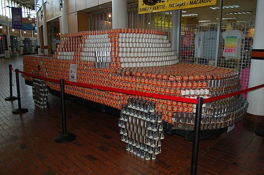 Students from Jacksonville Country Day School and volunteers from Second Harvest North Florida stacked canned goods Saturday at the Landing to create a life-size replica Ford F-150 pickup truck. The eventually edible structure is part of the annual "C...