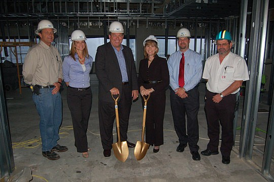 Photos by Max Marbut - From left, Auld &amp; White Constructors Superintendent Kevin Thompson; Lori Thomas, EverBank Center senior property manager; Executive Suite Professionals co-founder Duke Addison; company Managing Member Lisa Gufford; Auld &amp...