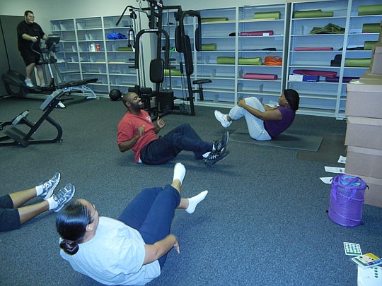 Photo by Karen Brune Mathis - Employees at Martin Gottlieb &amp; Associates are given time to exercise at the office.