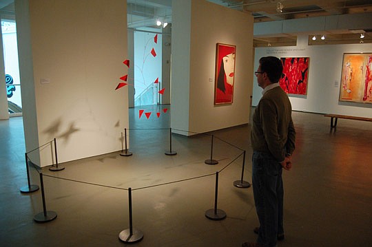 Photos by Max Marbut - Museum of Contemporary Art Curator Ben Thompson and a mobile by Alexander Calder, part of the "Inside/Out" exhibition of objects from the museum's permanent collection.
