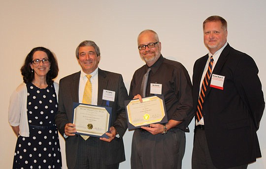 From left, Jacksonville Historical Preservation Commission Chairman Angela Schifanella, Daily Record Publisher Jim Bailey, Daily Record Staff Writer Max Marbut and commission member Richard Moore. The commission presented the Daily Record with a Prese...