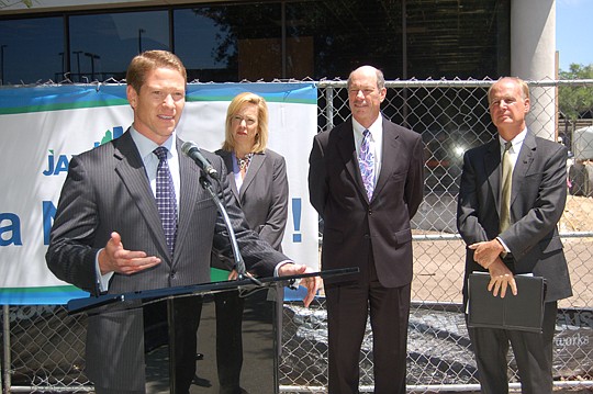 Photo by Max Marbut - State Rep. Daniel Davis (at podium) was announced Friday as president and CEO of the JAX Chamber, effective July 1. From left, search committee Chair Kelly Madden, JAXUSA Partnership President Jerry Mallot and chamber Chair Greg ...