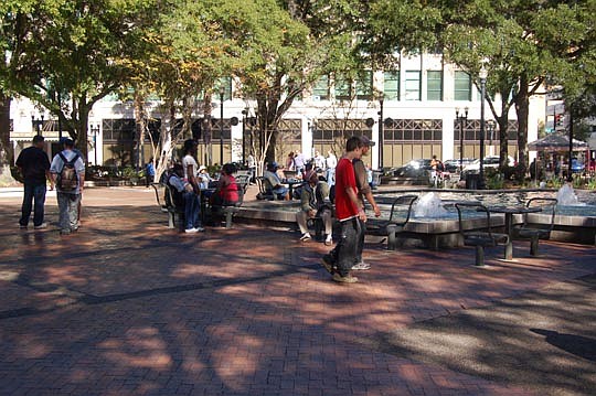 Photo by Max Marbut - Many people, including those who are homeless, gather each day in Hemming Plaza. A day center for the homeless three blocks from the plaza is scheduled to open in July.