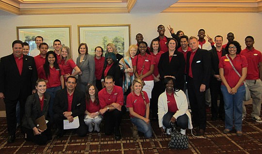 Far left, Hyatt Downtown General Manager Dan King with hotel staff and students from Wolfson High School who participated in "Beyond School Walls," a Big Brothers Big Sisters of Northeast