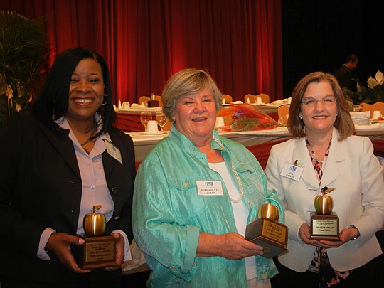 Photos by Karen Brune Mathis - The 2013 EVE awards were presented Friday to (from left) Cheryl Quarles-Gaston, principal of Carter G. Woodson Elementary School; Bernadette Moran, board member and past president of The Arc Jacksonville; and Nina Waters...