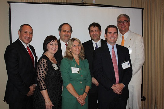 The 2013-14 executive board of the E. Robert Williams American Inn of Court are (front row, from left), President-elect Michael Rudolph, Vice President Tara Sa'id, Treasurer Vanessa Herbert and Administrator Robert Williams. Back row, President Judge ...