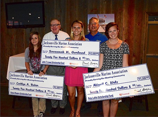 Back row, from left, Davis Johnston, 121 Financial Credit Union senior vice president of operations, and Joe Springer, Jacksonville Marine Association board member, presented scholarships to Jacksonville high school seniors (from left) Caitlyn Baker, ...