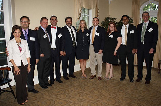 Photos by Joe Wilhelm Jr. - Braxton Gillam of the Milam Howard law firm was sworn in Friday at Epping Forest Yacht Club as the president of The Jacksonville Bar Association. The JBA board of governors members in attendance included (from left) Giselle...