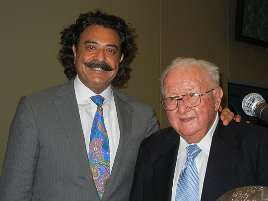 Photo by Karen Brune Mathis - Jacksonville Jaguars owner Shad Khan and Harry Frisch, chairman of Beaver Street Fisheries. Both immigrated to the United States and built their businesses.