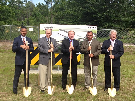 (from left) Ted Carter, City Office of Economic Development executive director; Steve Grossman, authority executive director and CEO; A.L. Kelly, authority board chair; Jerry Hernandez, Flightstar CEO; and Richard Biter, department assistant secretary...