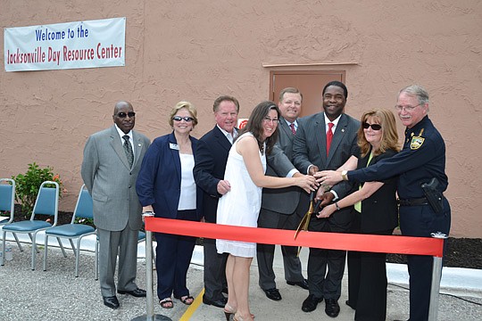 Photo by Tanya Austin, City of Jacksonville - A ribbon-cutting ceremony for the grand opening of the Jacksonville Day Resource Center on Monday featured H.T. Rhim; Penny Kievet, City Rescue Mission resource development director; City Council member Do...