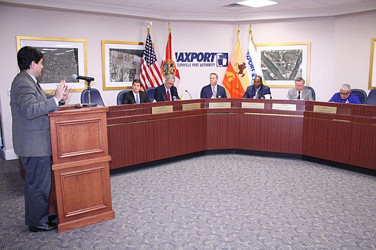 Assistant General Counsel Jason Gabriel (left) explains to the Jacksonville Port Authority board the City Office of General Counsel's opinion of no conflict of interest for former Horizon Lines executive Brian Taylor to serve as the authority's CEO.